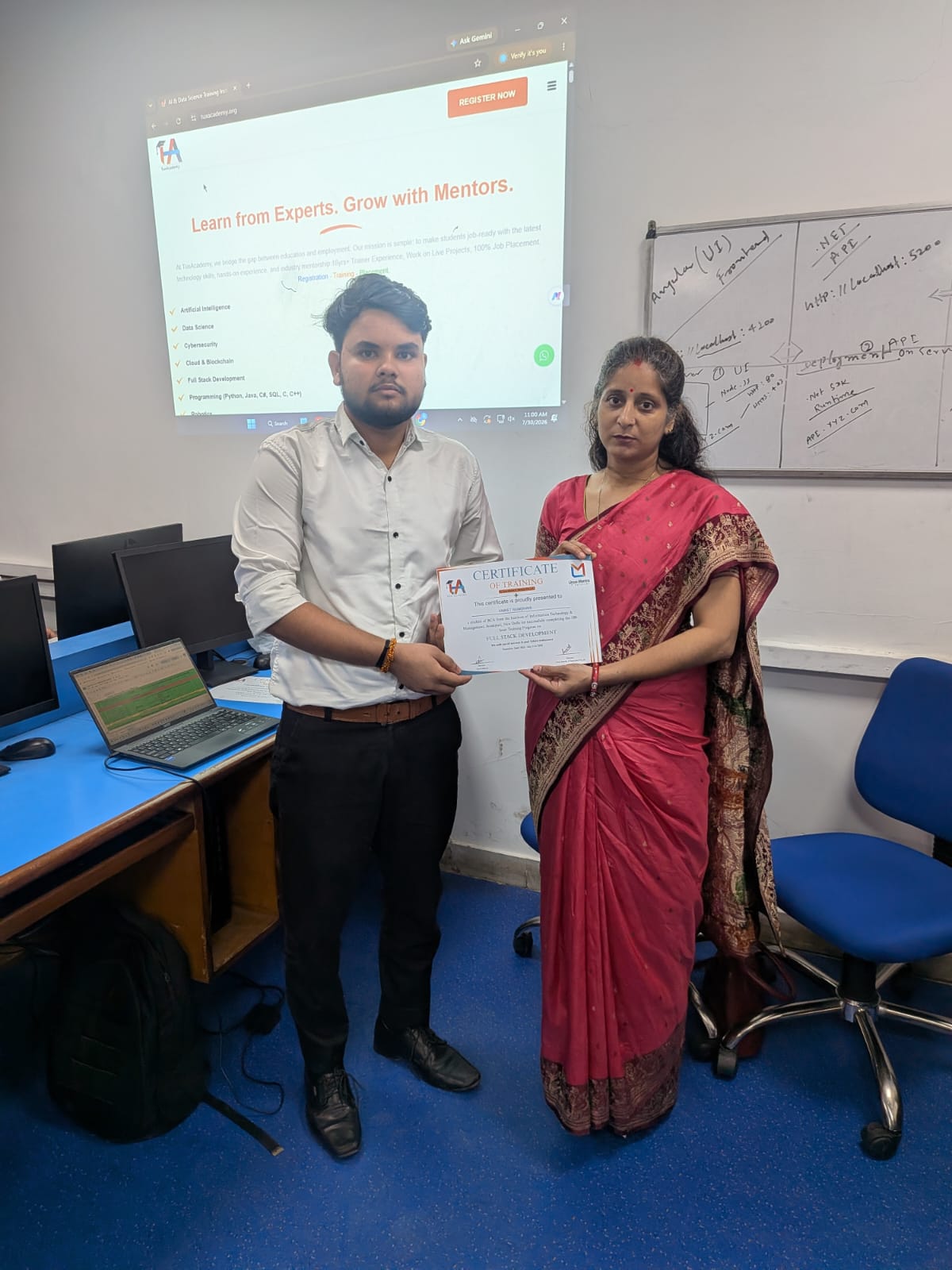 Student receiving Full Stack Development certificate at TuxAcademy
