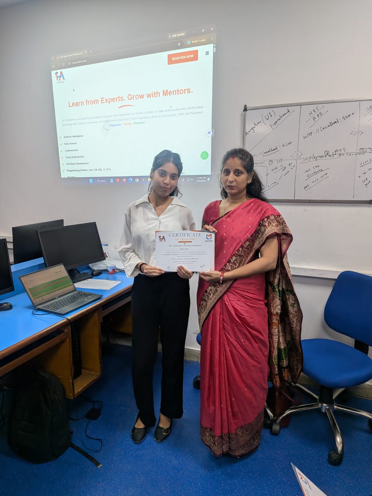Student receiving Full Stack Development certificate at TuxAcademy