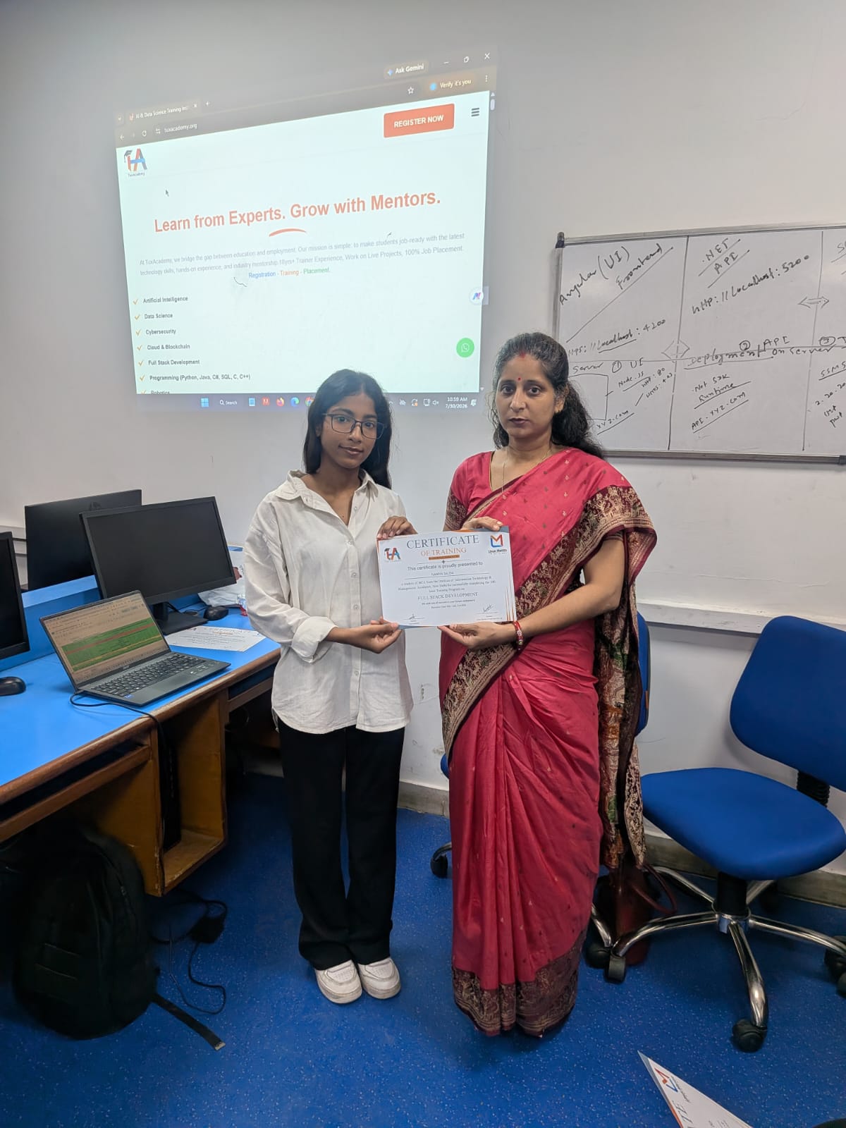 Student receiving Full Stack Development certificate at TuxAcademy