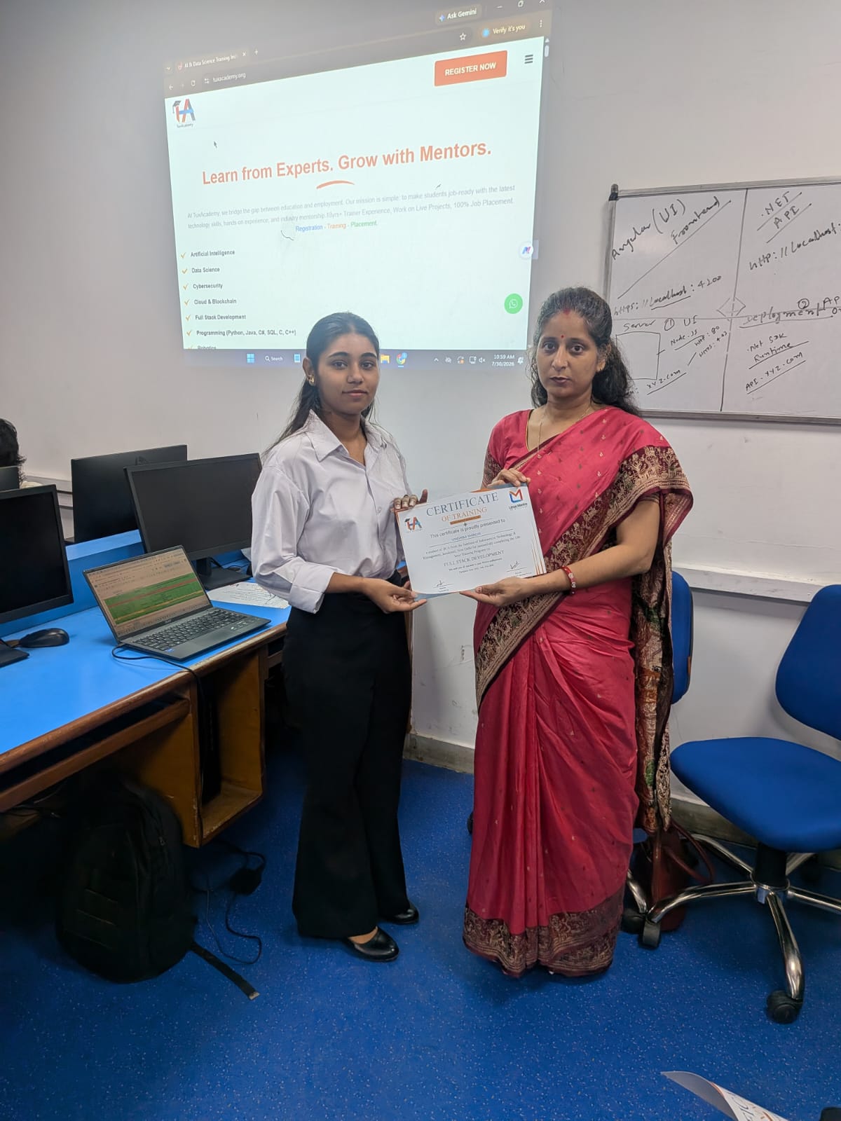 Student receiving Full Stack Development certificate at TuxAcademy