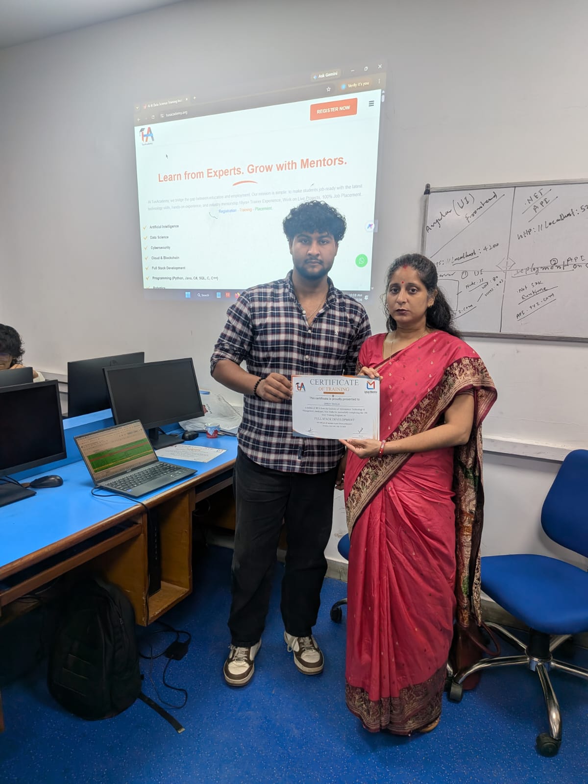Student receiving Full Stack Development certificate at TuxAcademy