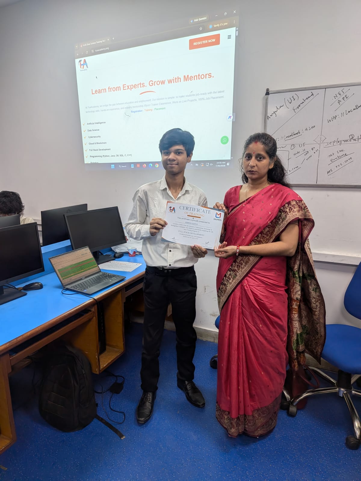 Student receiving Full Stack Development certificate at TuxAcademy
