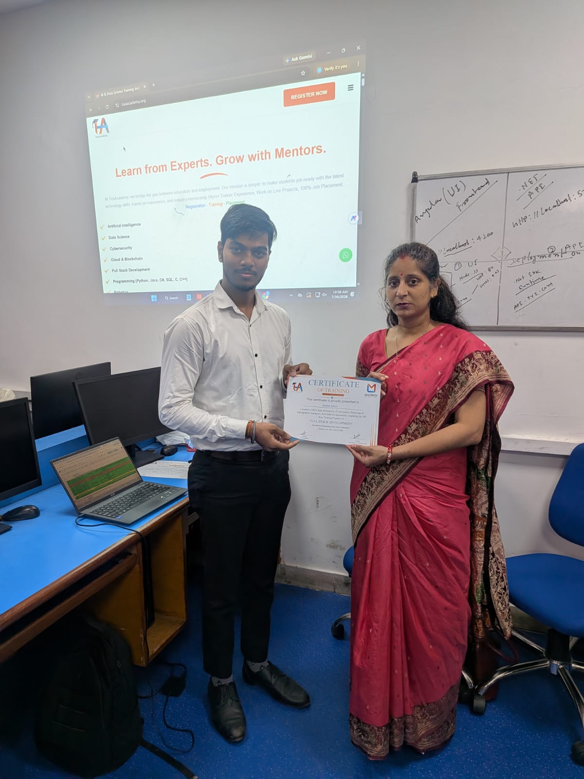 Student receiving Full Stack Development certificate at TuxAcademy