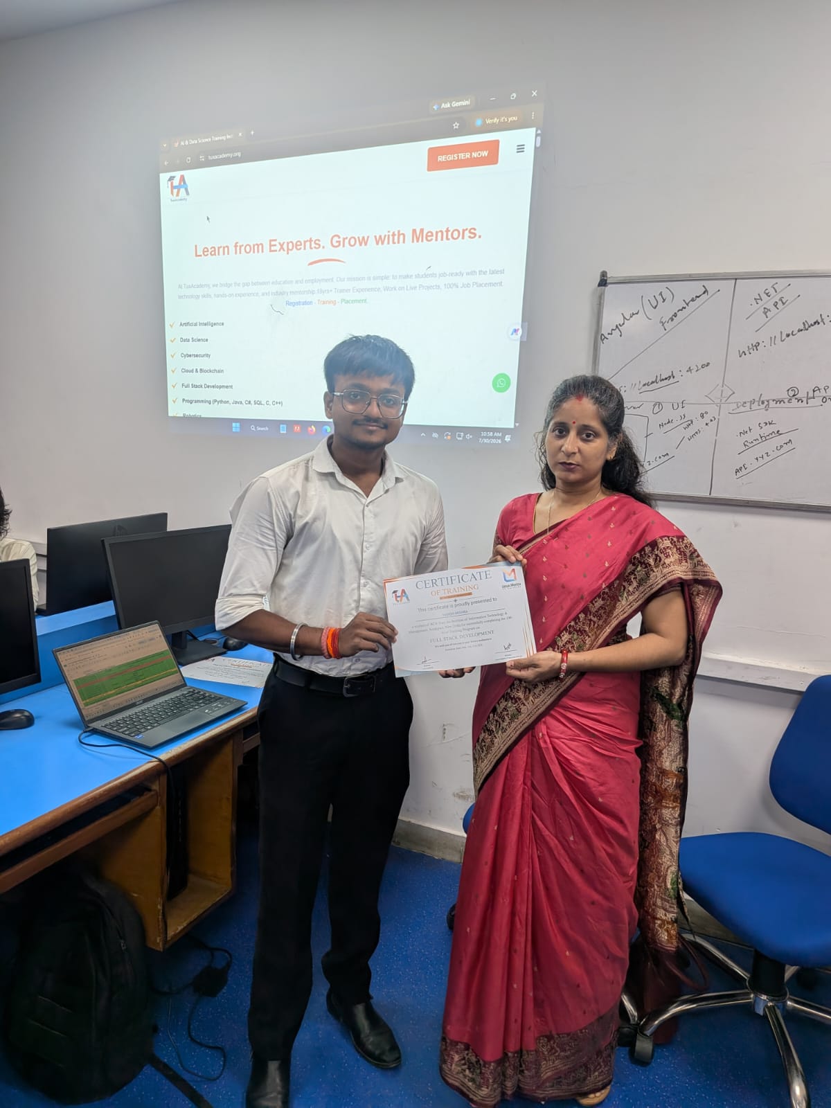 Student receiving Full Stack Development certificate at TuxAcademy